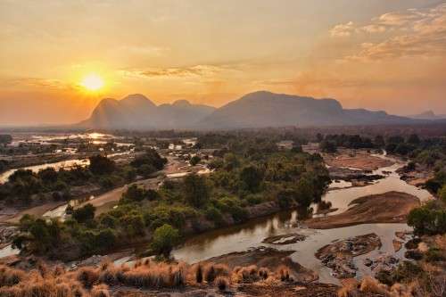The Lugenda River in Niassa wanders across a plain studded with inselbergs, or granite mountains.